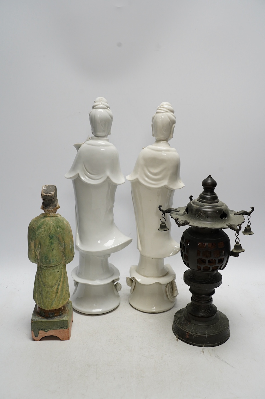 Two Chinese blanc de chine figures, a pottery figure and a metal incense burner, tallest item 35.5cm high. Condition - poor to fair